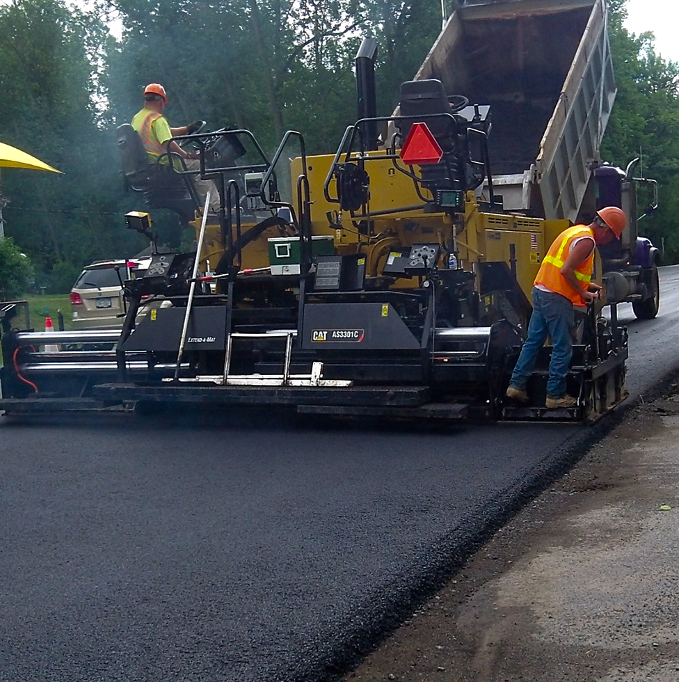 Construction team working on pavement